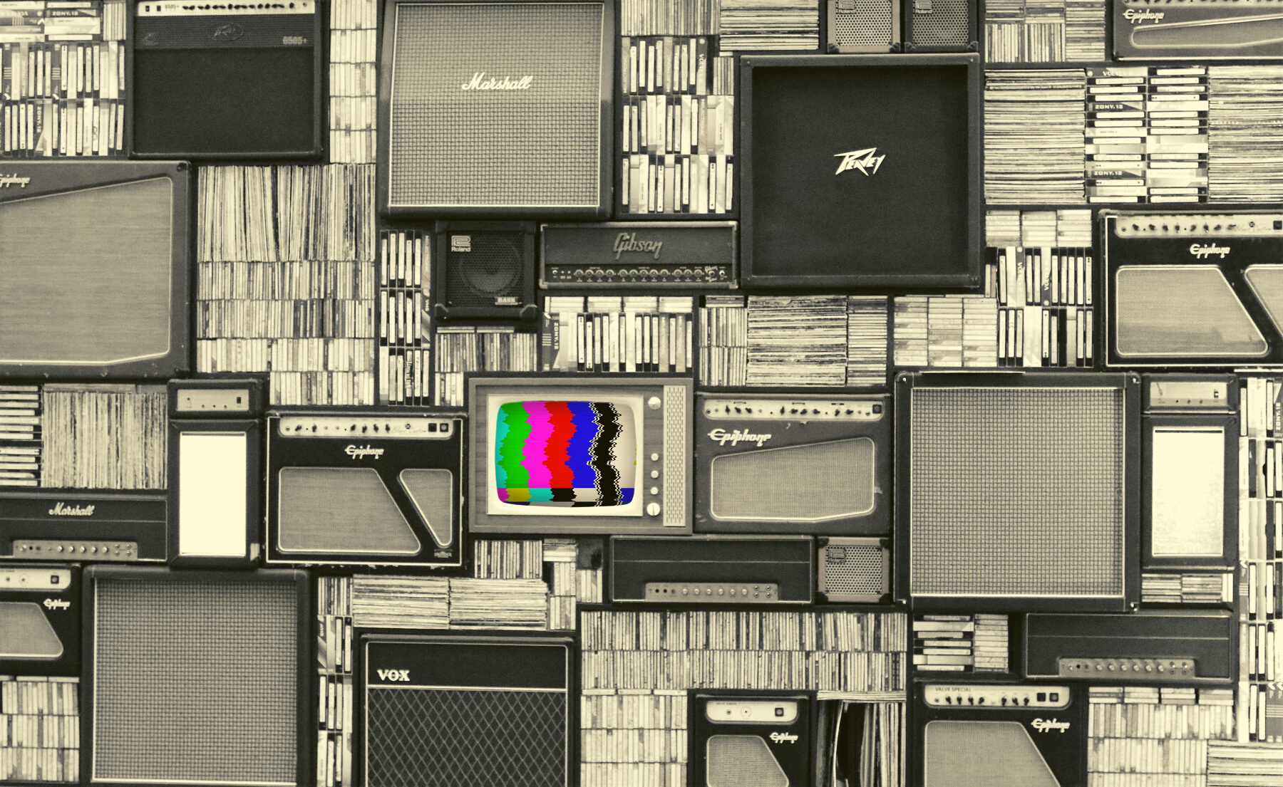 Wall Of Black And White Speakers With Colorful Television